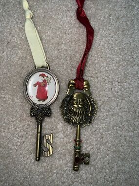 Two Holiday Santa Key Ornaments - one is Hallmark, not sure of other
